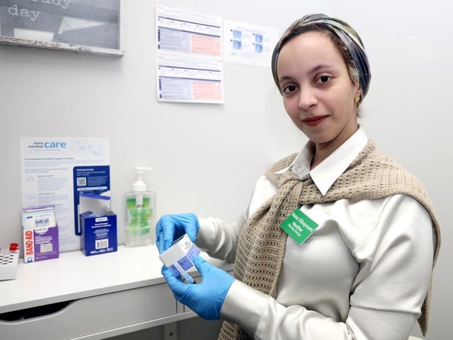  Pharmacy Manager Heba (Heather) Elbayoumi from Heathers Pharmacy and Travel Clinic in Kensington with the meal vaccines in Calgary on Friday, April 4, 2025.
