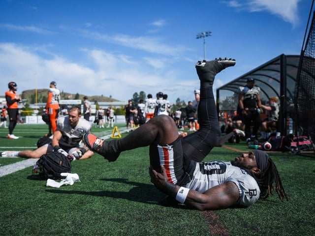 B.C. Lions running back James Butler stretches during the CFL football team's training camp, in Kamloops on Tuesday