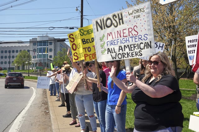 People rally on Wednesday, April 23, 2025, in support of some 185 researchers and other employees of the National Institute for Occupational Safety and Health (NIOSH) in Morgantown, W.Va., who received reduction-in-force notices as part of a larger push by the U.S. Department of Health and Human Services to dismiss 10,000 federal employees. (AP Photo/Gene J. Puskar)