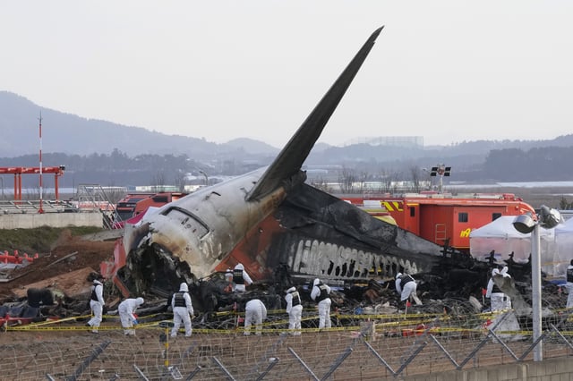 FILE - Rescue team members work at the site of a plane crash at Muan International Airport in Muan, South Korea on Dec. 31, 2024. (AP Photo/Ahn Young-joon, File)