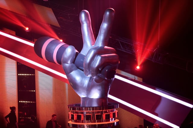 A file photo from 2016 shows the set of the German spinoff live television series, &#39;The Voice Kids.&#39; The latest episode of &#39;The Voice&#39; in the U.S. premiered May 13, 2025.