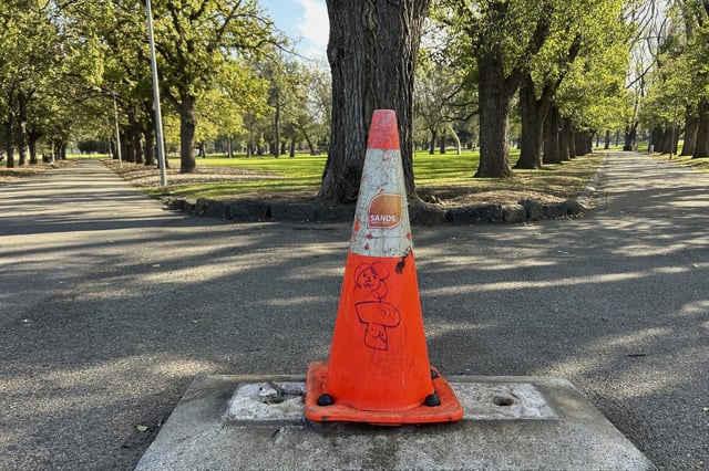 A traffic cone sits where a monument of British explorer Capt. James Cook once stood before it was removed following continued vandalism at a park Melbourne, Australia, Wednesday, May 14, 2025. (AP Photo/Rod McGuirk)