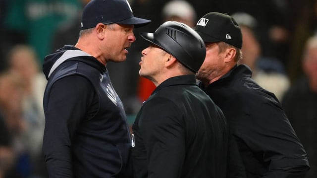 New York Yankees manager Aaron Boone argues with umpire Mark Wegner