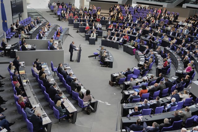 Friedrich Merz delivers his first speech as German Chancellor in the parliament in Berlin, Germany, Wednesday, May 14, 2025. (AP Photo/Markus Schreiber)