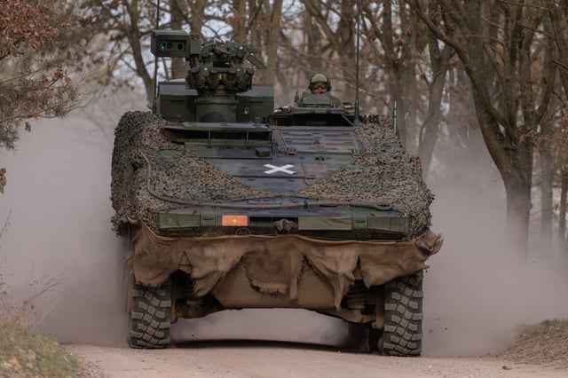 A Boxer armoured fighting vehicle of the Bundeswehr, the German armed forces, is driven during a demonstration for members of the media on April 9, 2025 near Gardelegen, Germany.