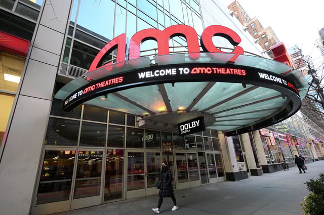 A pedestrian walks by the AMC 34th Street theater on March 5, 2021, in New York. 