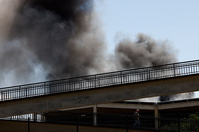 Smoke billows from a fire at a chemical plant in Seville, Spain May 14, 2025. REUTERS/Marcelo del Pozo