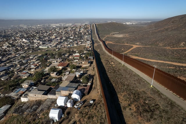 Aerial view of a camp of the Mexican National Guard recently mounted next to the Mexico-US border as part of Operation Frontera Norte, in eastern Tijuana, Baja California State, Mexico, on February 26, 2025. Mexico on February 4 began moving troops to its northern border as part of a 10,000-member deployment to tighten measures against illegal migration and cross-border smuggling of the drug fentanyl that President Claudia Sheinbaum promised US counterpart Donald Trump in exchange for a delay of his tariffs.