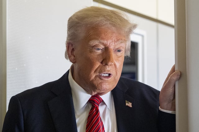 President Donald Trump speaks to reporters aboard Air Force One en route from Riyadh, Saudi Arabia to Doha, Qatar, Wednesday, May 14, 2025.
