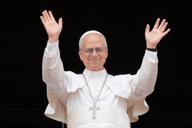 Pope Leo XIV appears at the central balcony of St. Peter&#39;s Basilica for his first Sunday blessing after his election, in St. Peter&#39;s Square at the Vatican, Sunday, May 11, 2025. (AP Photo/Gregorio Borgia)
