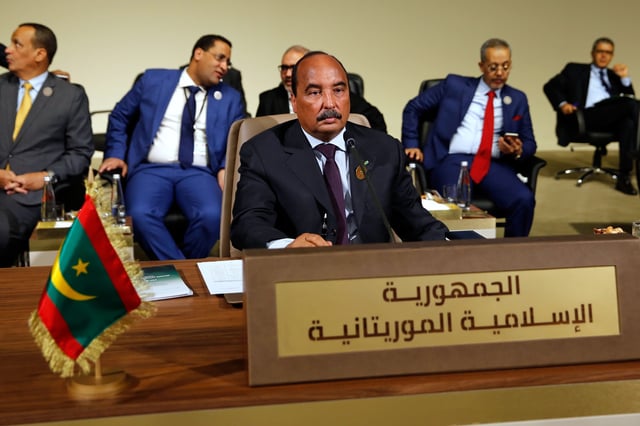 FILE - In this Jan. 20, 2019, file photo, Mauritania's President Mohamed Ould Abdel Aziz, center, attends the Arab Economic and Social Development Summit, in Beirut, Lebanon. (AP Photo/Bilal Hussein, File)