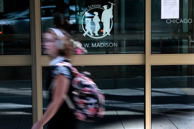 A person walks by Chicago Public Schools headquarters on May 28, 2024. (Antonio Perez/Chicago Tribune)