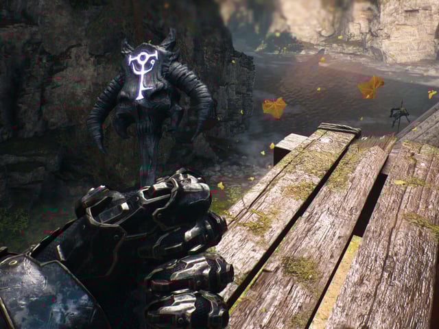 Doom: The Dark Ages purple key Siege Part 1 - A first-person image of Doom Guy holding the demonic purple key in his left hand.