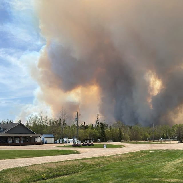 Smoke rises from a wildfire as seen off Granite Park Road in Lac Du Bonnet, Man., on May 13.