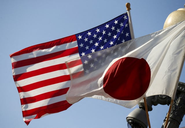 The U.S. and Japan flags fly together outside the White House in Washington April 27, 2015. REUTERS/Kevin Lamarque/File Photo