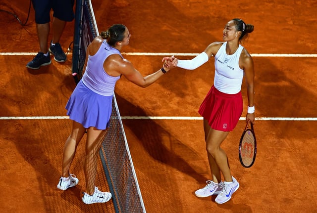 Tennis - Italian Open - Foro Italico, Rome, Italy - May 14, 2025 China's Qinwen Zheng shakes hands with Belarus' Aryna Sabalenka after winning their quarter final match REUTERS/Yves Herman