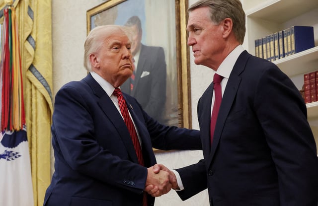 U.S. President Donald Trump shakes hands with former U.S. Senator David Perdue during Perdue's swearing-in ceremony to be the new U.S. ambassador to China, at the White House in Washington, D.C., U.S., May 7, 2025. REUTERS/Leah Millis/File Photo