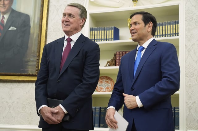 David Perdue and Secretary of State Marco Rubio listen as President Donald Trump speaks before Perdue was sworn in as U.S. Ambassador to China during a ceremony in the Oval Office of the White House, Wednesday, May 7, 2025, in Washington. (AP Photo/Mark Schiefelbein)