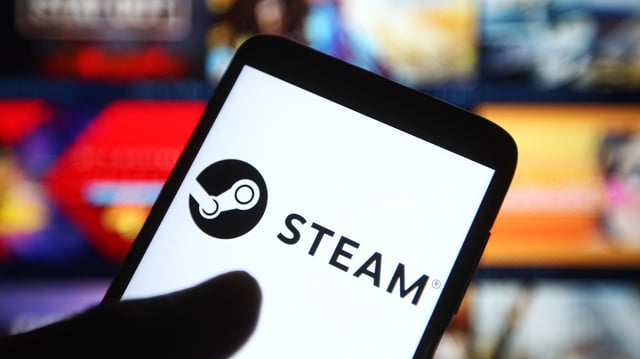 Auf dem Bild ist ein Smartphone zu sehen, das das Steam-Logo anzeigt.