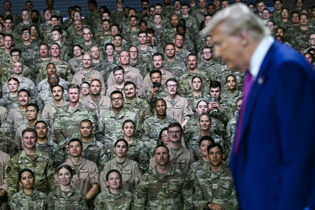 US President Donald Trump arrives to address troops at the Al-Udeid air base southwest of Doha