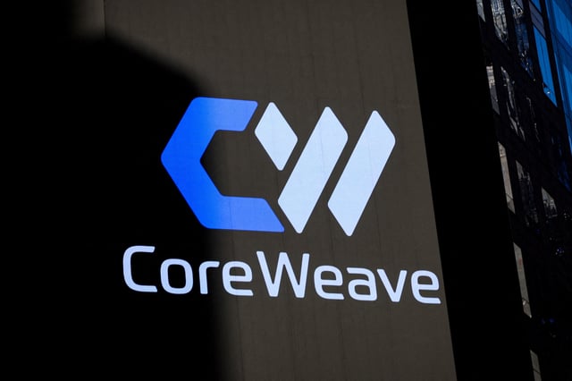 A screen displays the company logo for CoreWeave, Inc., Nvidia-backed cloud services provider, during the company's IPO at the Nasdaq Market, in New York City, U.S., March 28, 2025. REUTERS/Brendan McDermid/File Photo