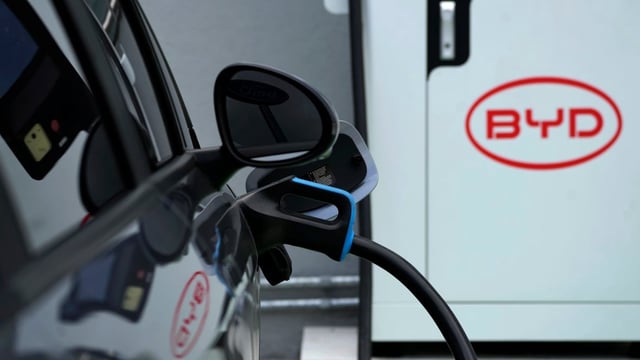 A BYD electric vehicle charges at a dealership in Brazil. BYD is now the largest EV maker in the world, and is increasingly exporting its affordable models to emerging economies. 