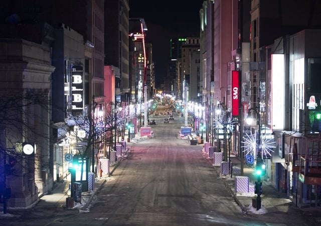 An empty Ste-Catherine Street is shown in Montreal, Saturday, Jan. 9, 2021, during the COVID-19 pandemic. The Quebec government imposed a nighttime curfew to help stop the spread of COVID-19. THE CANADIAN PRESS/Graham Hughes