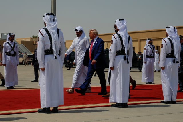 U.S. President Donald Trump walks to board Air Force One as he departs Al Udeid Air Base, en-route to Abu Dhabi, United Arab Emirates, in Doha, Qatar, May 15, 2025. REUTERS/Brian Snyder