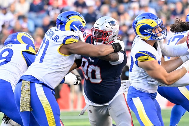 Nov 17, 2024; Foxborough, Massachusetts, USA;  New England Patriots defensive tackle Christian Barmore (90) blocks Los Angeles Rams offensive tackle Warren McClendon Jr. (71) during the first half at Gillette Stadium. Mandatory Credit: Eric Canha-Imagn Images/File Photo
