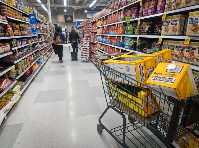 EDMONTON, CANADA  MARCH 27, 2025:
A well-stocked supermarket with aisles filled with various products in Edmonton, Alberta, Canada, on March 27, 2025. 