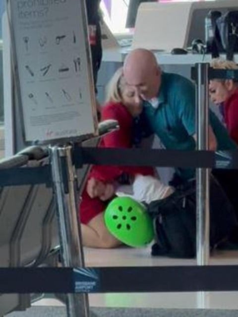 A man is wrestled to the ground in the Virgin terminal at Brisbane's domestic airport.