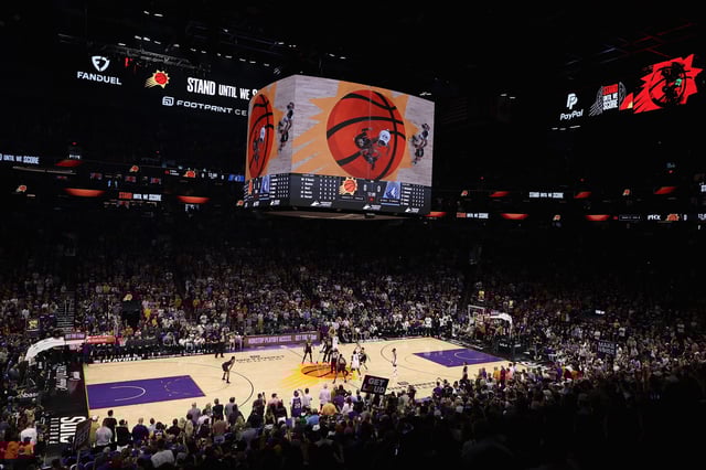 General view of action as Jusuf Nurkic #20 of the Phoenix Suns and Rudy Gobert #27 of the Minnesota Timberwolves jump for the opening tip during the first half of game four of the Western Conference First Round Playoffs at Footprint Center on April 28, 2024, in Phoenix, Arizona.