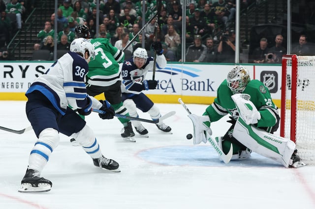 Morgan Barron #36 of the Winnipeg Jets shoots against Jake Oettinger #29 of the Dallas Stars during the second period at American Airlines Center on April 10, 2025 in Dallas, Texas.
