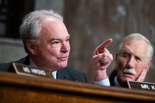 Sen. Tim Kaine, D-Va., left, questions Defense Secretary Pete Hegseth during his Senate Armed Services Committee confirmation hearing on Jan. 14. Sen. Angus King, I-Maine, is at right.