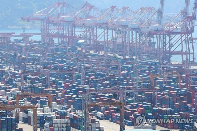 In this file photo, containers are waiting to be shipped at a port in Busan, about 385 kilometers southeast of Seoul, on April 30, 2025. (Yonhap)