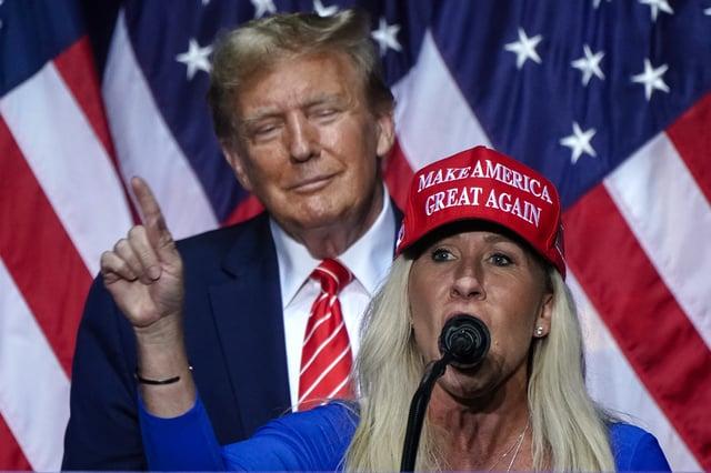 Representative Marjorie Taylor Greene is seen speaking alongside then-former US President and 2024 presidential hopeful Donald Trump at a campaign event in Rome, Georgia, on March 9, 2024. (Photo by Elijah Nouvelage / AFP) (Photo by ELIJAH NOUVELAGE/AFP via Getty Images)