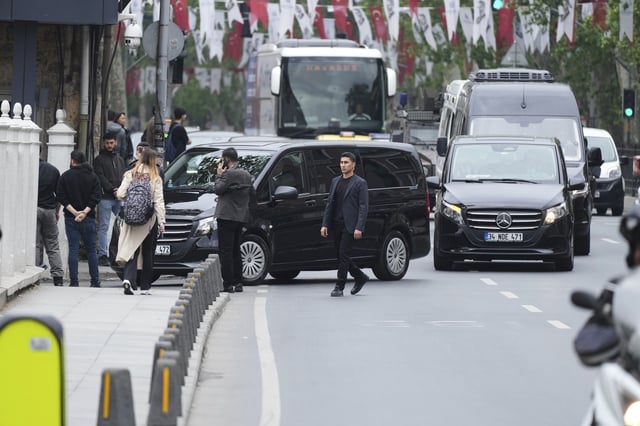 Vehicles begin arriving outside a gate prior to expected talks between Russian and Ukrainian delegations at the Dolmabache palace, in Istanbul, Turkey, Friday, May 16, 2025. (AP Photo/Dilara Acikgoz)
