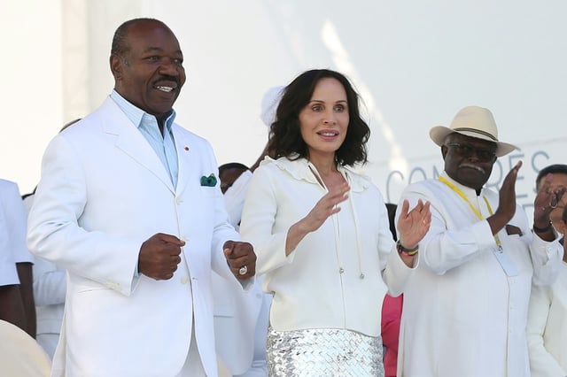 Bongo (L) and his French-born wife  Sylvia (2nd L) have arrived in the Angolan capital, Luanda said