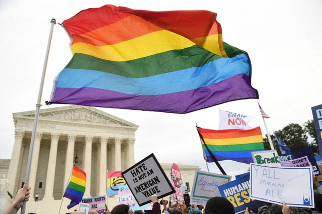 Demonstrators in favor of LGBTQ rights rally outside the U.S. Supreme Court in Washington, DC, October 8, 2019