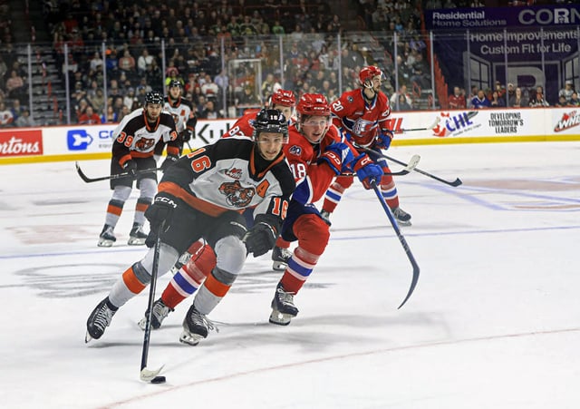 PHOTO COURTESY JEN SAMLL Medicine Hat Tigers forward Hunter St. Martin pushes off Spokane Chiefs' defenceman Will McIsaac before scoring on a breakaway in the second period of a 5-2 Game 4 win Wednesday in Spokane to lead the WHL Championship series 3-1.