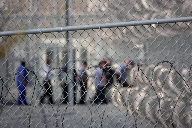 Employees leave the Otay Mesa Detention Center, which houses immigration detainees, on Oct. 5, 2021 in San Diego. (K.C. Alfred / U-T  file)