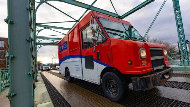 A Canada Post truck is seen in Montreal on Dec. 17, 2024.