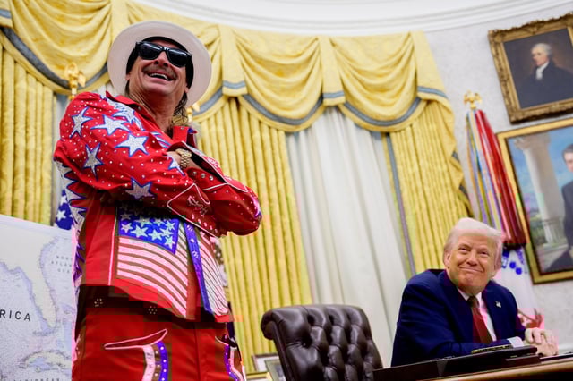 WASHINGTON, DC - MARCH 31: U.S. President Donald Trump, accompanied by entertainer Kid Rock, takes a question from a reporter during an executive order signing event in the Oval Office of the White House on March 31, 2025 in Washington, DC. Trump has signed an executive order against ticket scalping and reforming the live entertainment ticket industry. (Photo by Andrew Harnik/Getty Images)