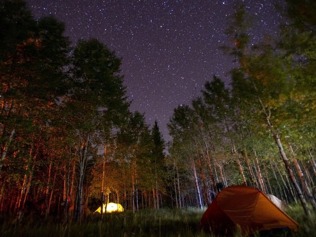 A starry night backcountry camping near Abraham Lake in Alberta.