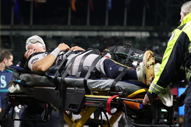 SEATTLE, WASHINGTON - MAY 12: Oswaldo Cabrera #95 of the New York Yankees is taken away in an ambulance during the ninth inning against the Seattle Mariners at T-Mobile Park on May 12, 2025 in Seattle, Washington.