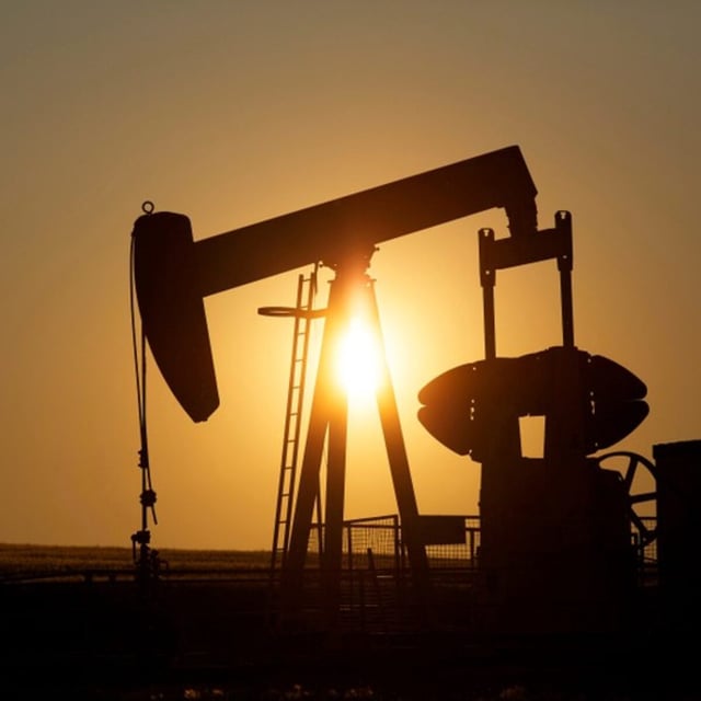 An oil pump jack pumps oil in a field near Calgary, Alberta, Canada on July 21, 2014.