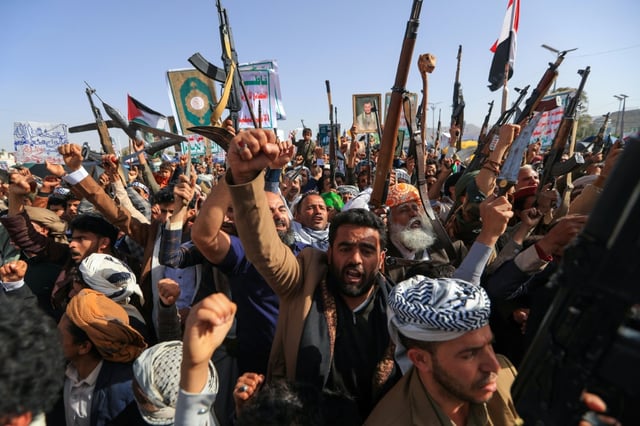Yemenis brandish rifles as they demonstrate against Israel in the rebel-held capital Sanaa.