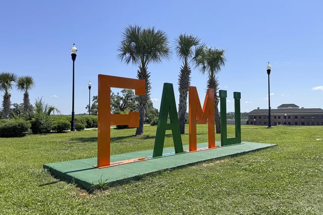A sign decorates the campus of Florida AM University in Tallahassee, Fla., Wednesday, May 14, 2025. (AP Photo/Kate Payne)