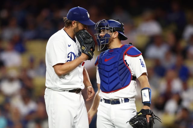 LOS ANGELES, CALIFORNIA - MAY 16: Clayton Kershaw #22 and Austin Barnes #15 of the Los Angeles Dodgers talk on the mound during the third inning against the Minnesota Twins at Dodger Stadium on May 16, 2023 in Los Angeles, California.