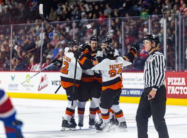 SPECIAL TO THE NEWS COLTON MCKEE Medicine Hat Tigers defenceman Niilopekka Muhonen is swarmed after scoring his first WHL playoff goal, finding the back of the net in Game 5 of the WHL Championship Series Friday at Spokane against the Chiefs